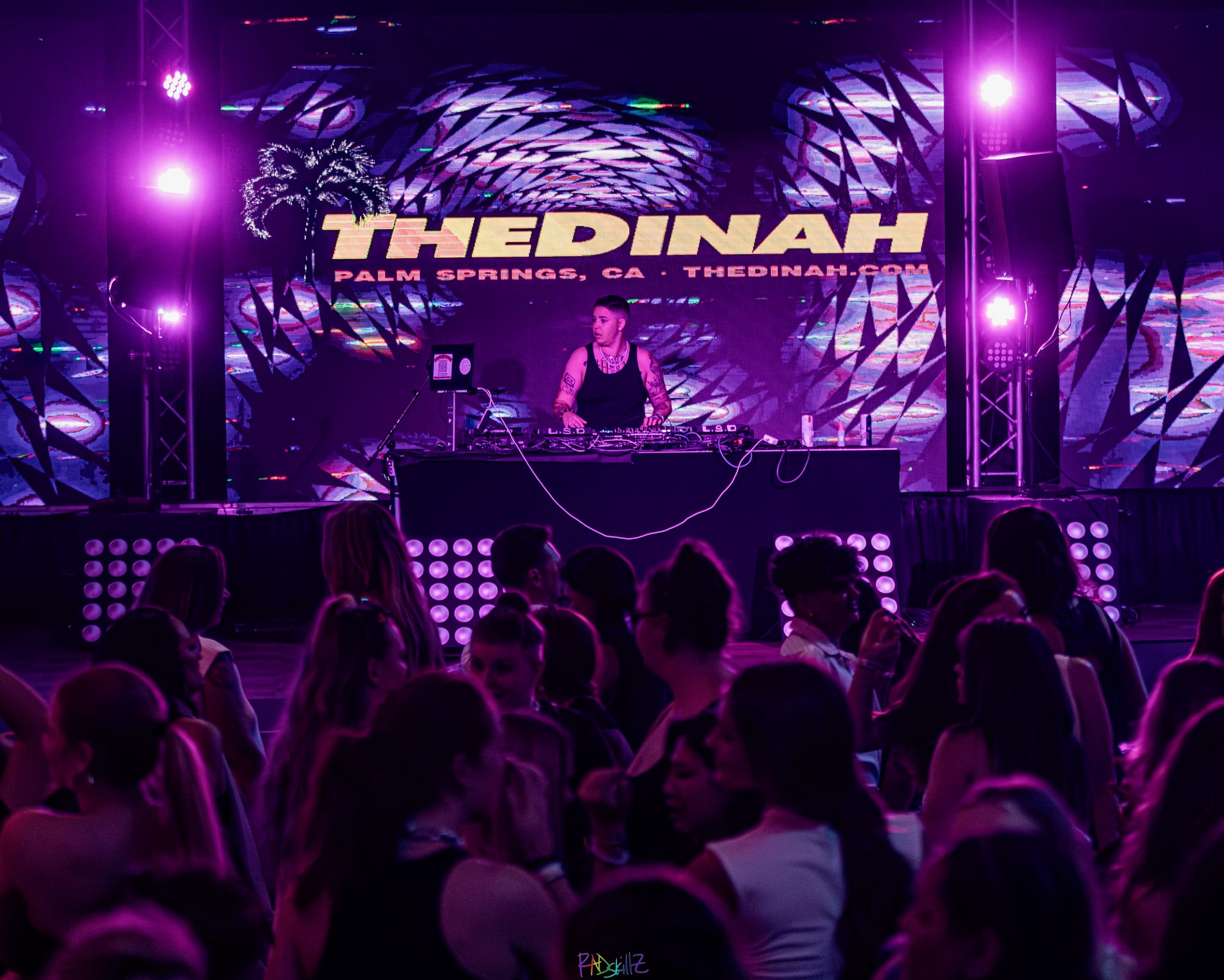 A DJ plays a set at queer women's festival The Dinah in Palm Springs. Photo courtesy of The Dinah / RADskillZ Photography.
