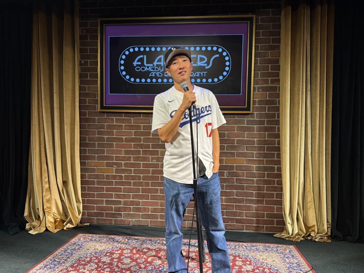 Comedian Paul "PK" Kim performs standup wearing a Dodgers hat and Shohei Ohtani jersey. Photo courtesy of Kim.