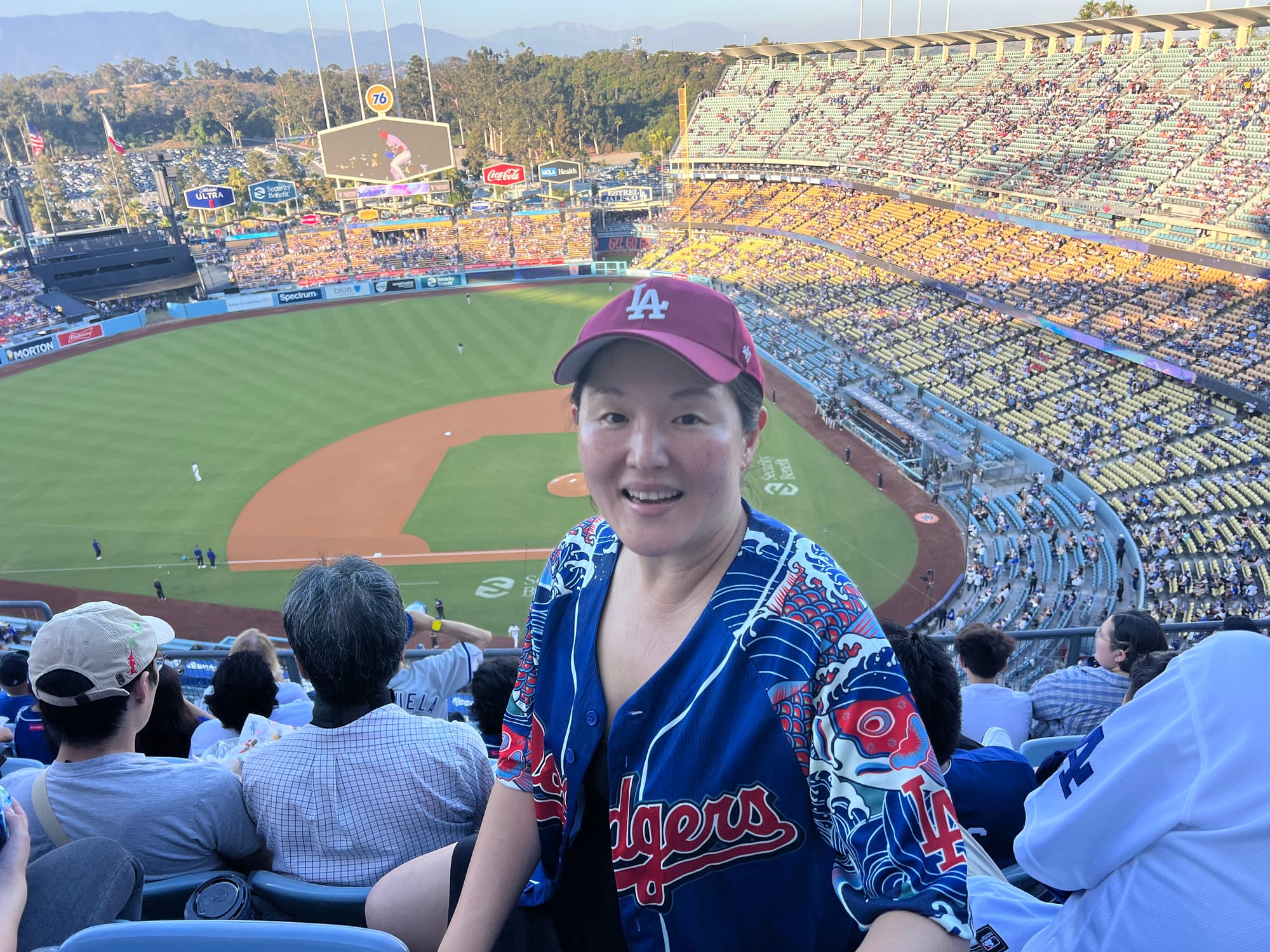 Nancy Wang Yuen wears a Japanese-style Dodgers jersey and baseball cap at a 2024 game. Photo courtesy of Yuen.