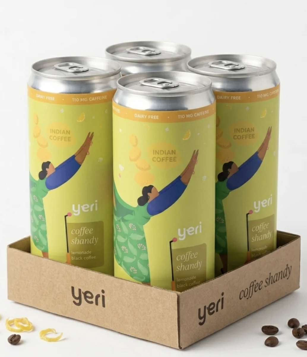 A 4-pack of tall, skinny cans of coffee shandy featuring an illustrated woman reaching up for lemons. The can is predominantly yellow.