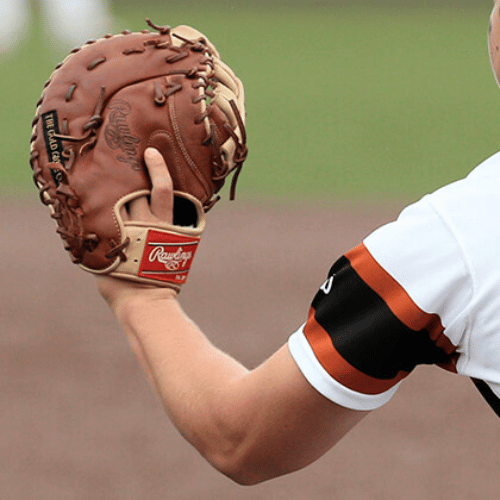 Baseball player showing a first base glove design