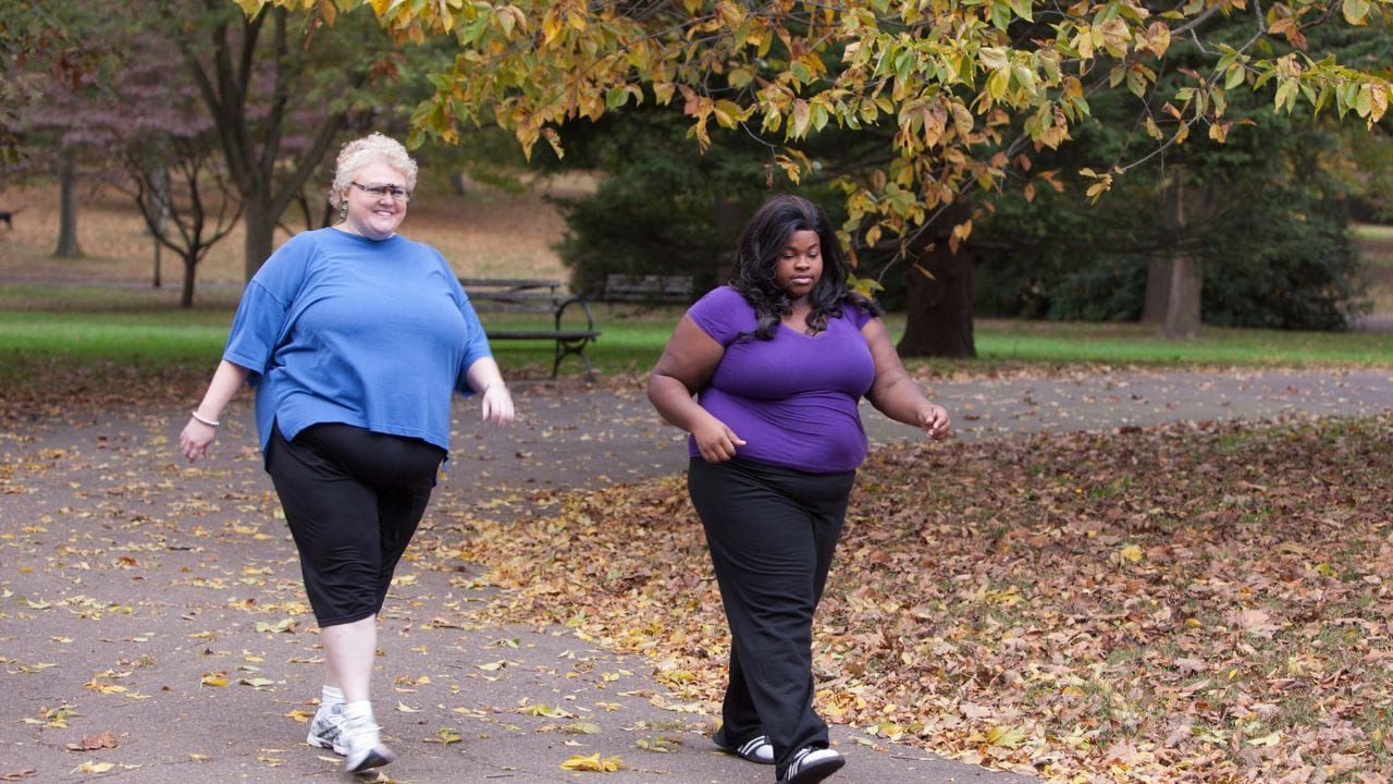 Overweight women walking in comfy shoes
