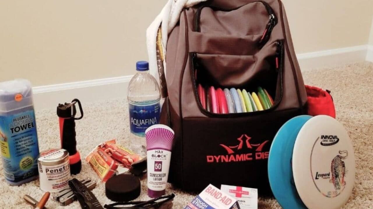 Disc golf bag and the contents its owner always has on hand