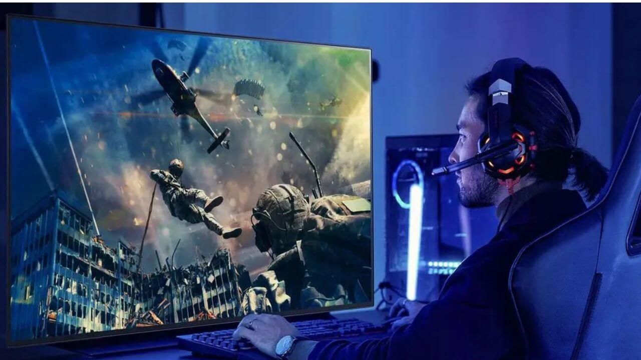 Man gaming on an OLED monitor