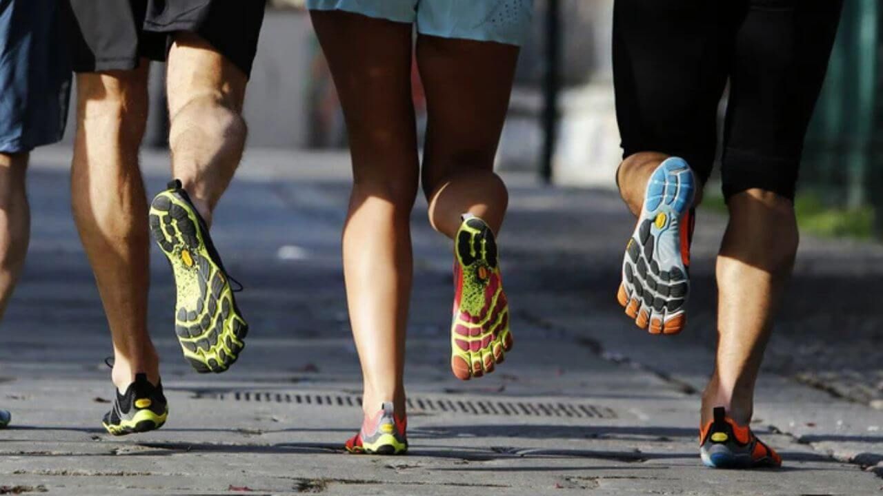 Runners running in barefoot running shoes