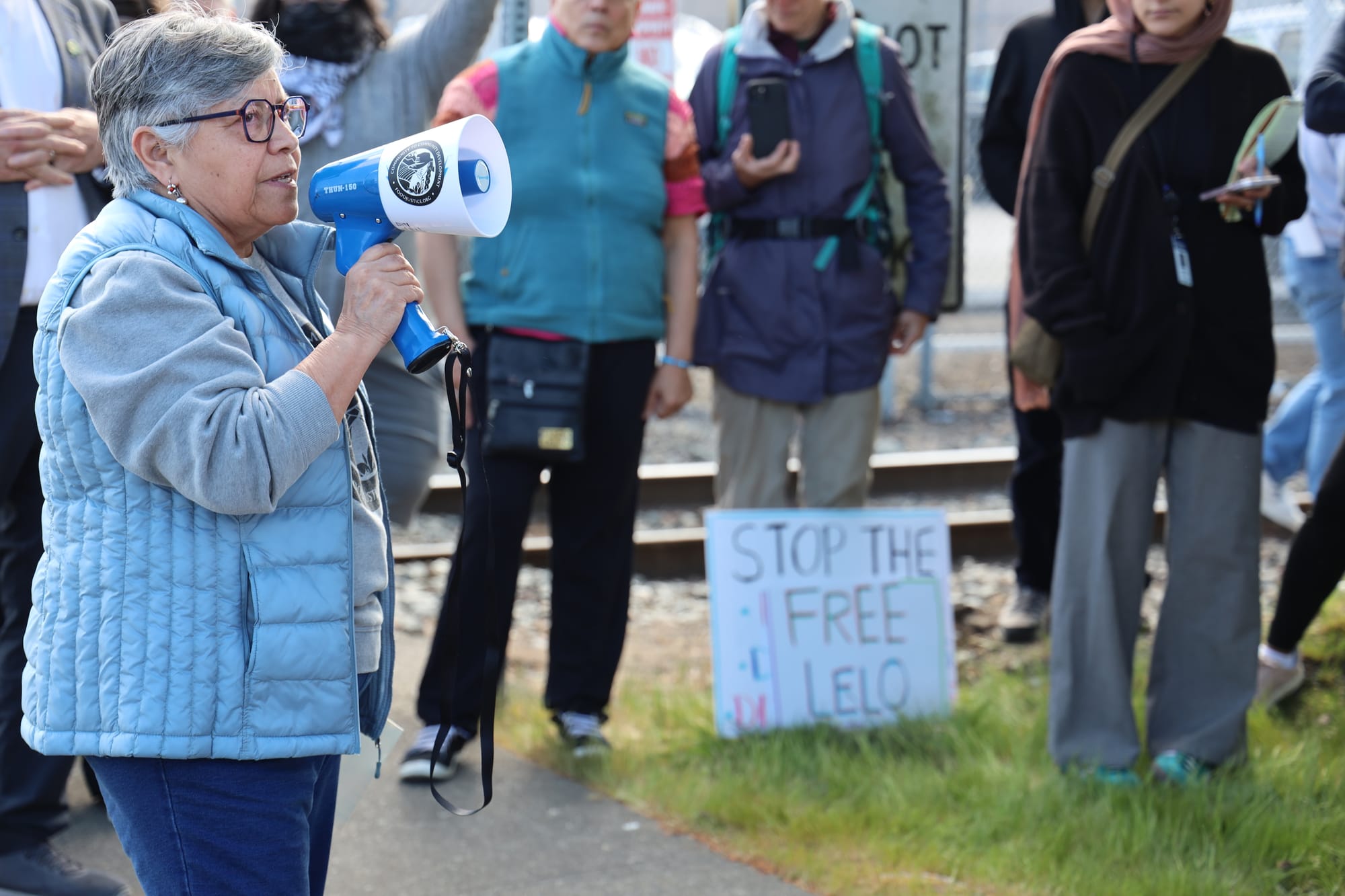person speaks into microphone