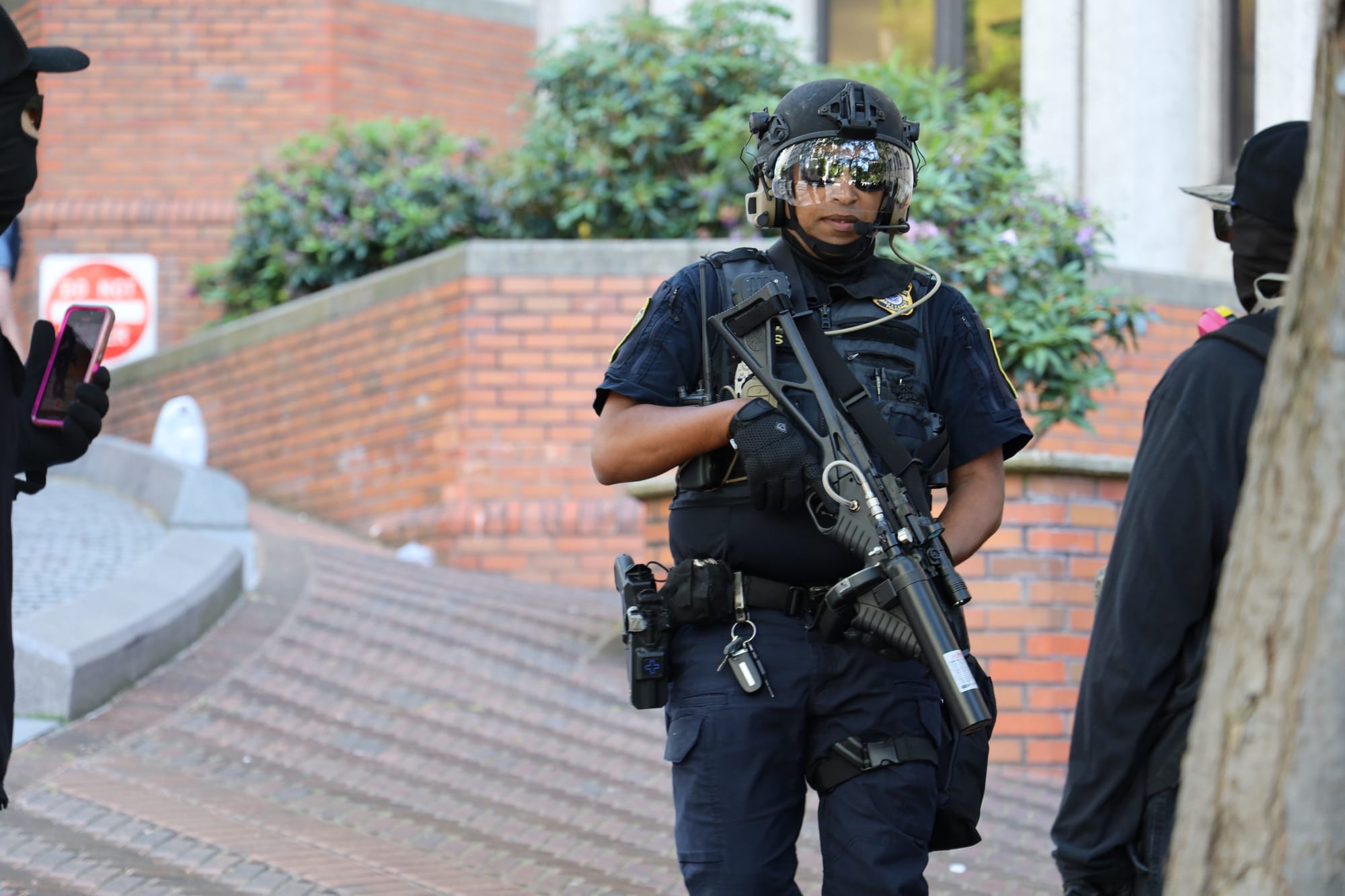 DHS officer with large gun