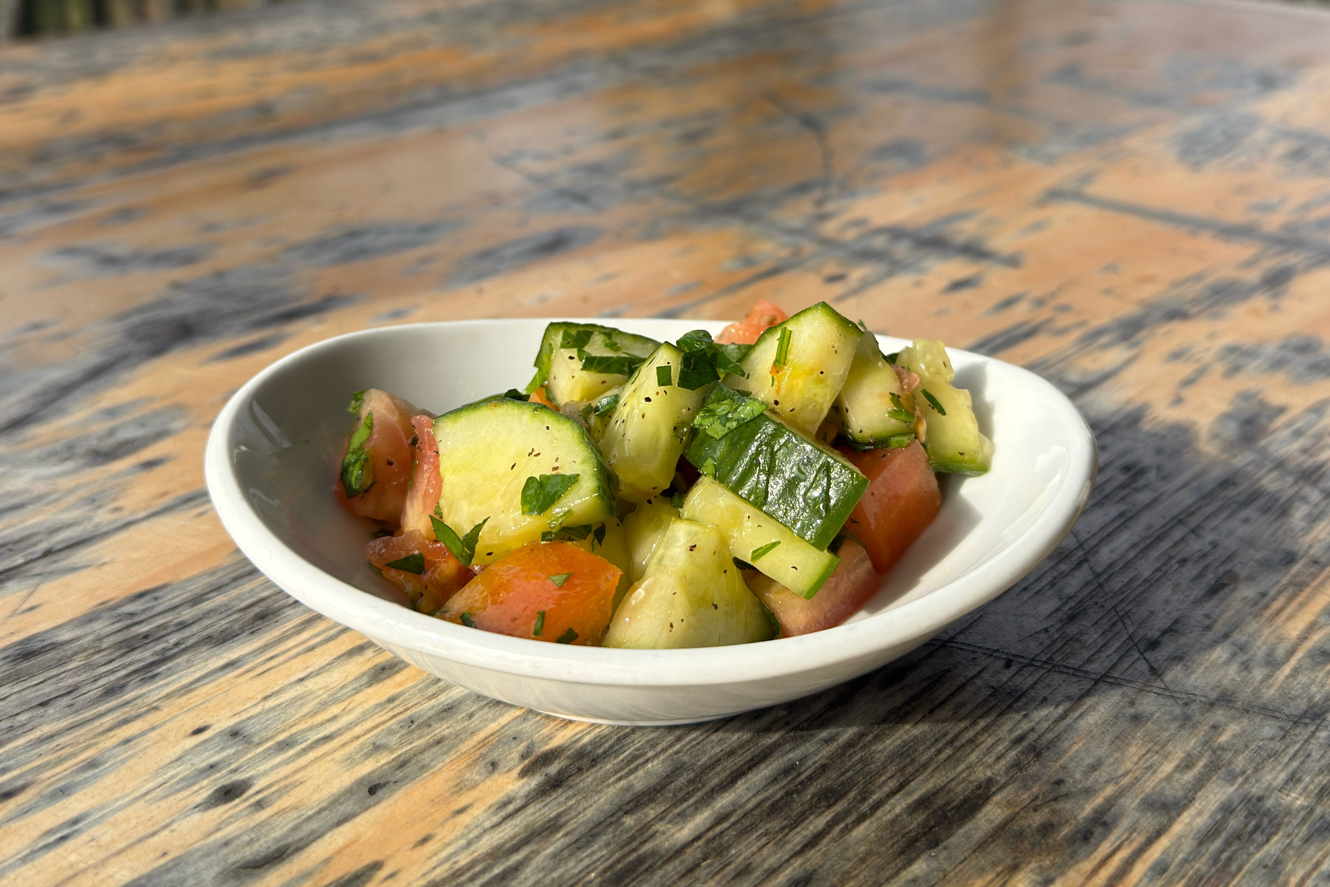 Cucumber and tomato salad with parsley