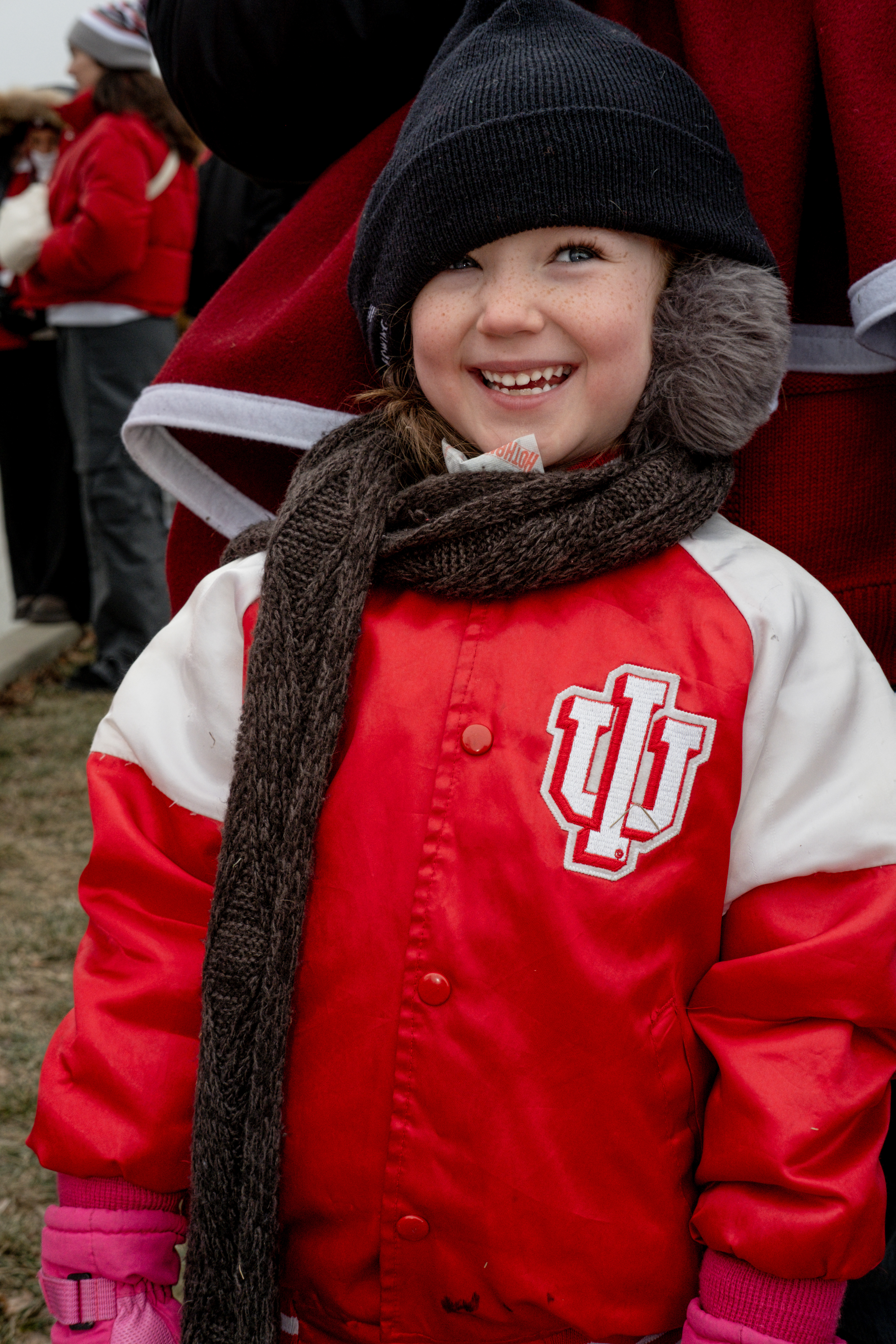 A young fan smiles despite the cold at the "Natty Celebration" at IU's Memorial Stadium. | Photo by Kathryn Coers Rossman