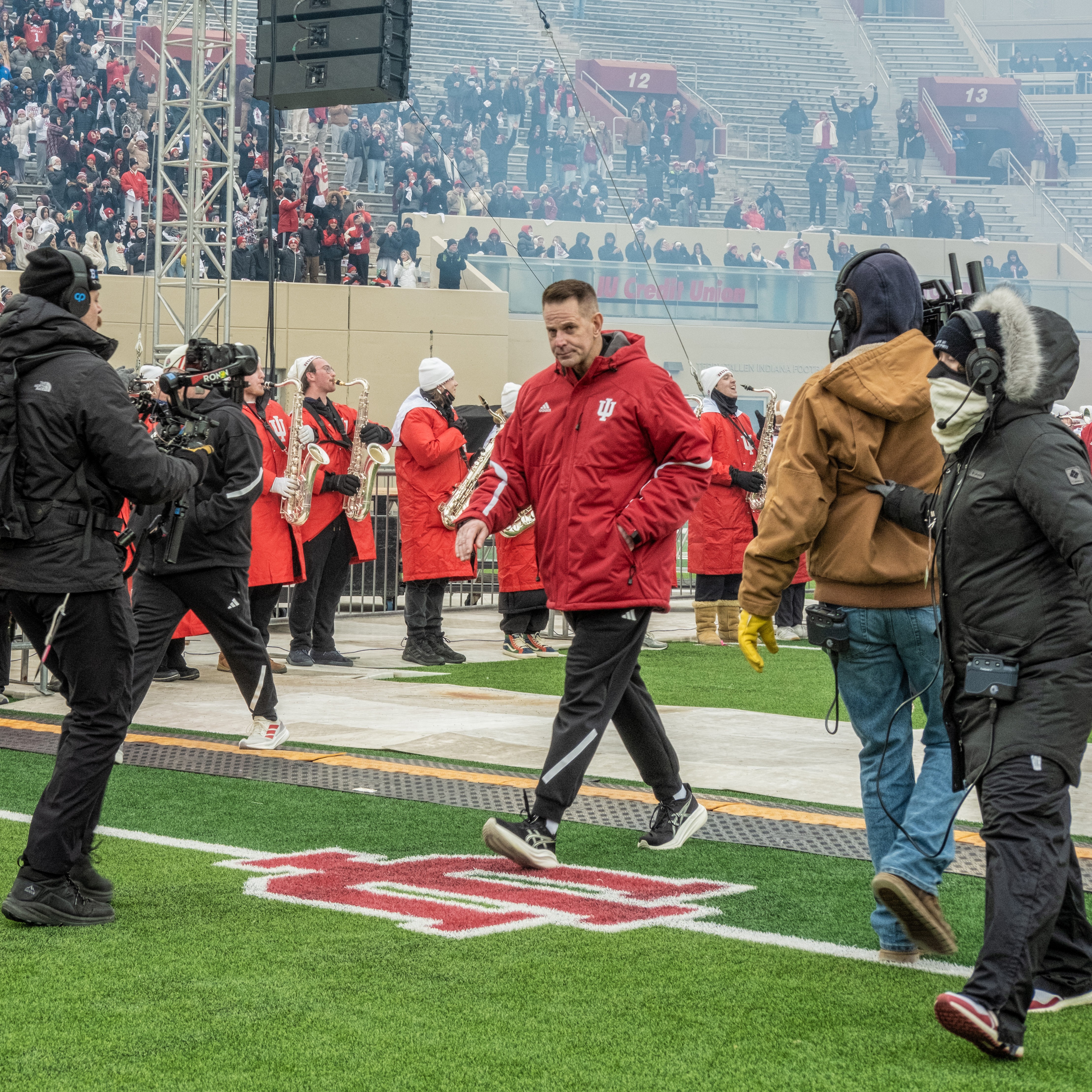 Coach Curt Cignetti walks onto the field amidst the festivities — and the media — at IU's celebration for his undefeated football team. | Photo by Kathryn Coers Rossman