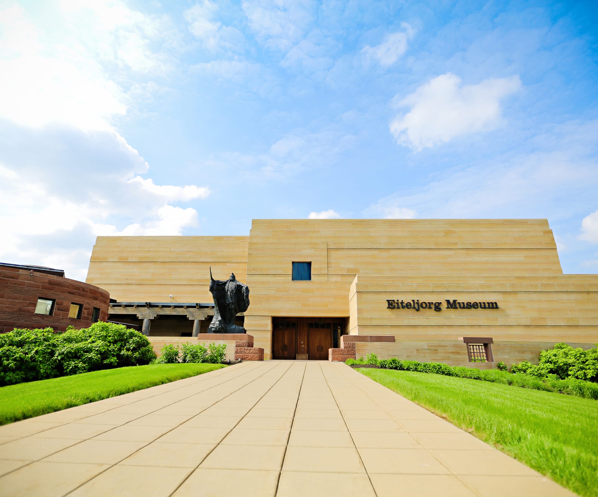 a large orange-tan building, designed like an adobe structure