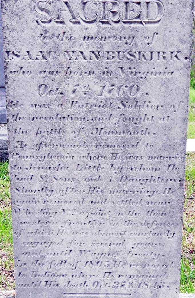 a tall gravestone with a weathered inscription. The words SACRED be the memory of ISAAC VAN BUSKIRK who was born in Virginia Oct. 7th, 1760