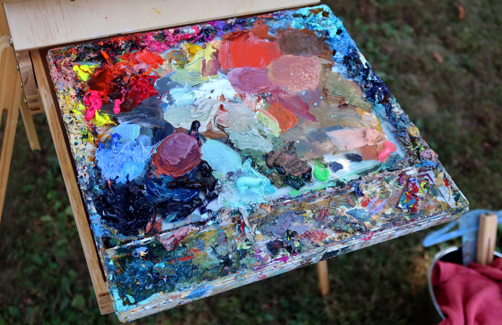 an oil paint palette covered in every color of paint