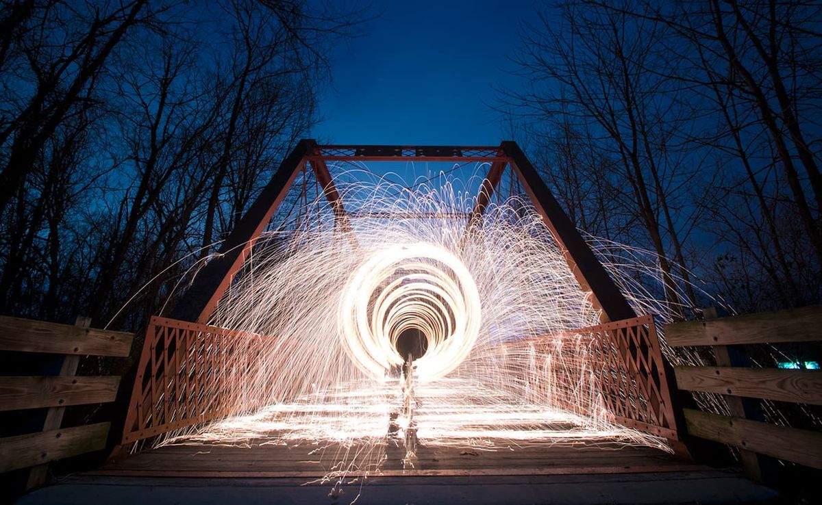 Nathan Clark spins steel wool on the Clear Creek Trail. Clark created this image by packing steel wool into a whisk, attachin