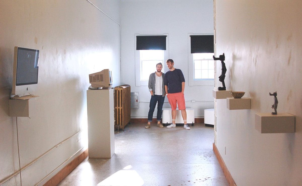 Artists William Bass, left, and Raphael Cornford stand at the end of their downtown gallery space, NOISE. Writer Lindsay Wels