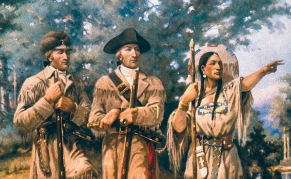 two white men (Lewis and Clark) in buckskin clothing stand beside a Shoshone woman (Sacajawea) who points out of frame