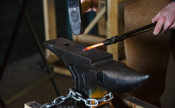 Terran Marks, resident blacksmith and owner of Brown County Forge, working in the Ingot Workshop at Artisan Alley, an artist