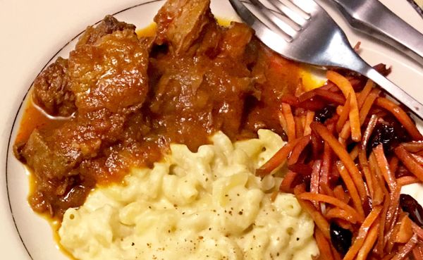 (clockwise from top left) Ruthie Cohen's beef stew, carrot salad with dried cherries, and macaroni and cheese. | Photo by Rut