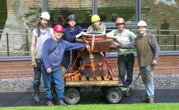 Iron casting crew in front of the historic Telford furnace in Coalbrookdale, England, at the International Conference of Cont