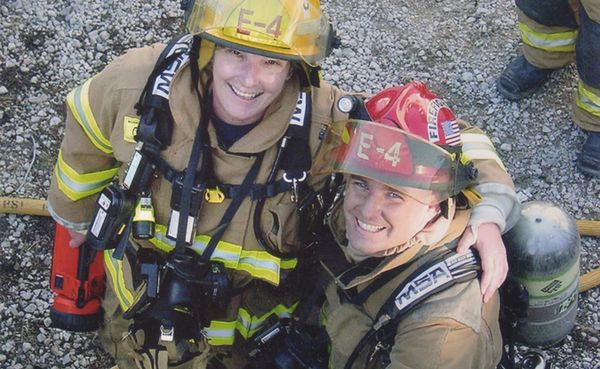 Jean Magrane (left), who became Bloomington's first woman firefighter in 1987, with Greg Lucas at the “Jiffy Treat training d