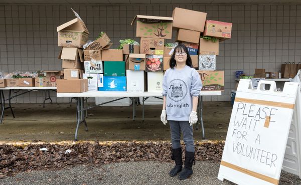 Abby Ang at the People’s Market CSA drive-thru on March 28. Ang and a group of vendors, community organizers, and university