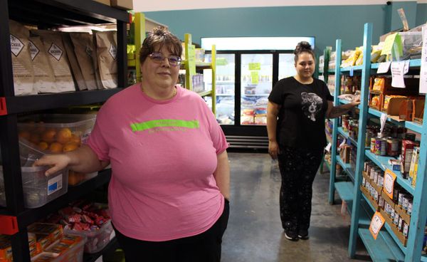 Cindy Chavez, left, and Traci Ayala run Pantry 279, a food bank in Ellettsville that has lost food supplies because of federa