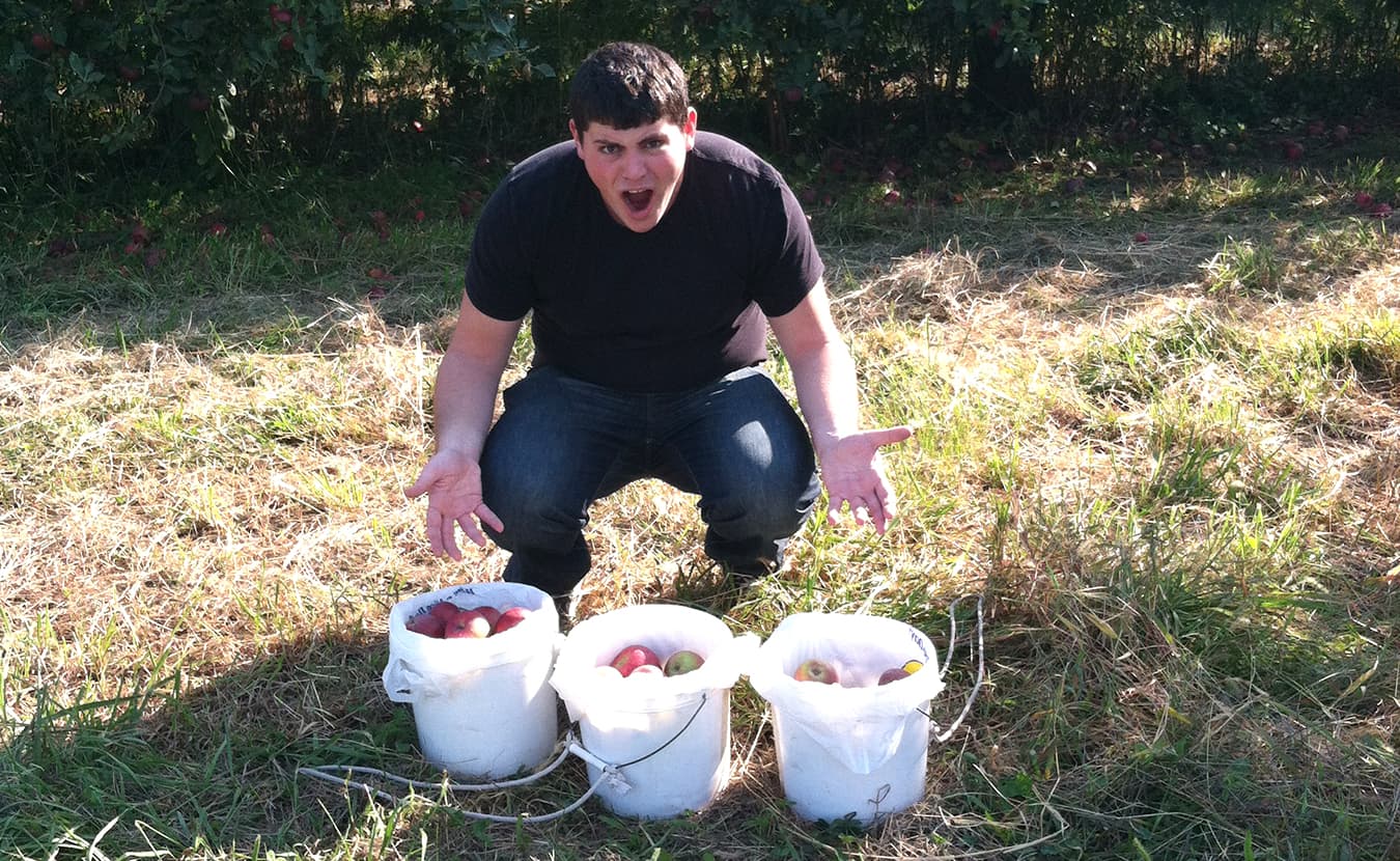 Ruthie's son, David Cohen, shows off their apple-picking haul in September 2012. | Courtesy photo