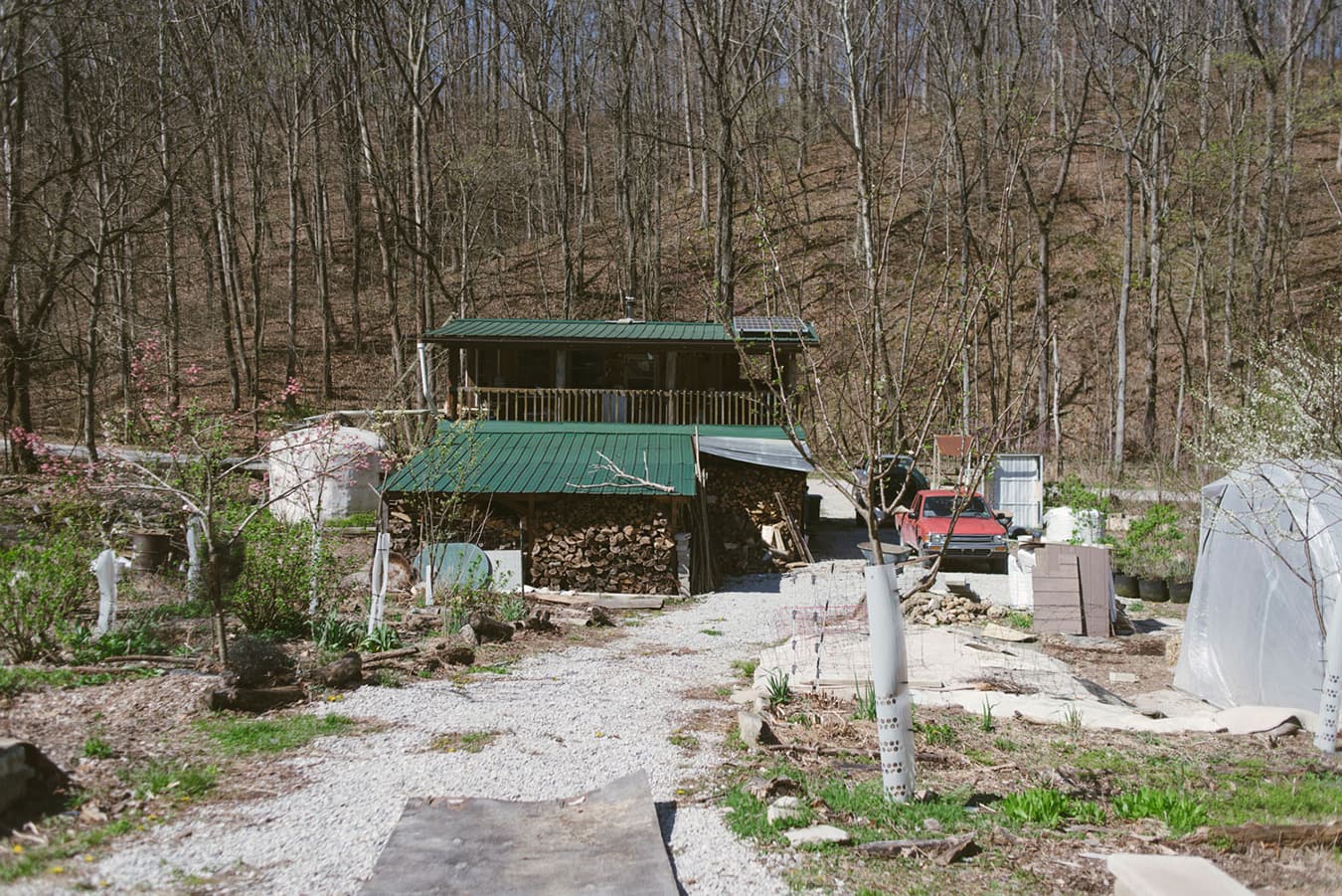 The Bread & Roses property, including this house, is off the grid. Solar panels on the roof provide electricity and a large water-collection tank is the primary water source for the property. | Photo by Natasha Komoda