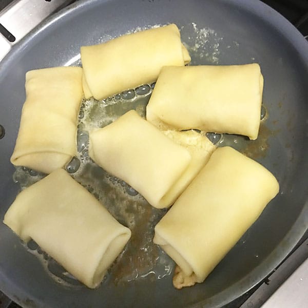 Uncrowded crepes frying in butter. | Photo by Ruthie Cohen