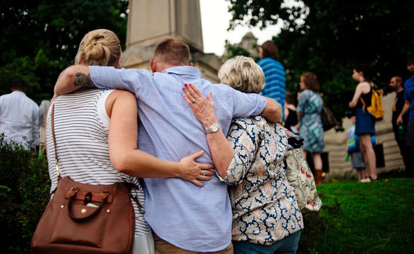 Maintaining connections to family and friends is an important aspect of harm reduction. Colin (center), a recovering addict, says not being honest with those closest to him impedes his recovery. | Photo by Natasha Komoda