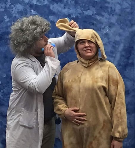 Ben Rardin (left) gives Rufus, played by Megan Wilhelm, a veterinary examination in 