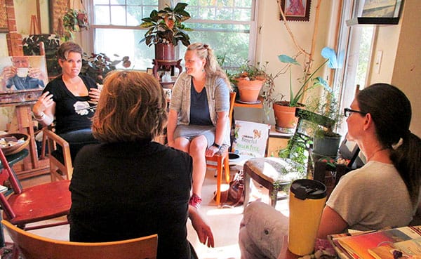 Artists (clockwise from left) Ellen Starr Lyon, Christy Wiesenhahn, Meg Lagodzki, and Sarah Pearce gather in Lyon's home studio for Yaël Ksander's story "Remembering To Be an Artist When Life Gets in the Way" | Photo by Yaël Ksander