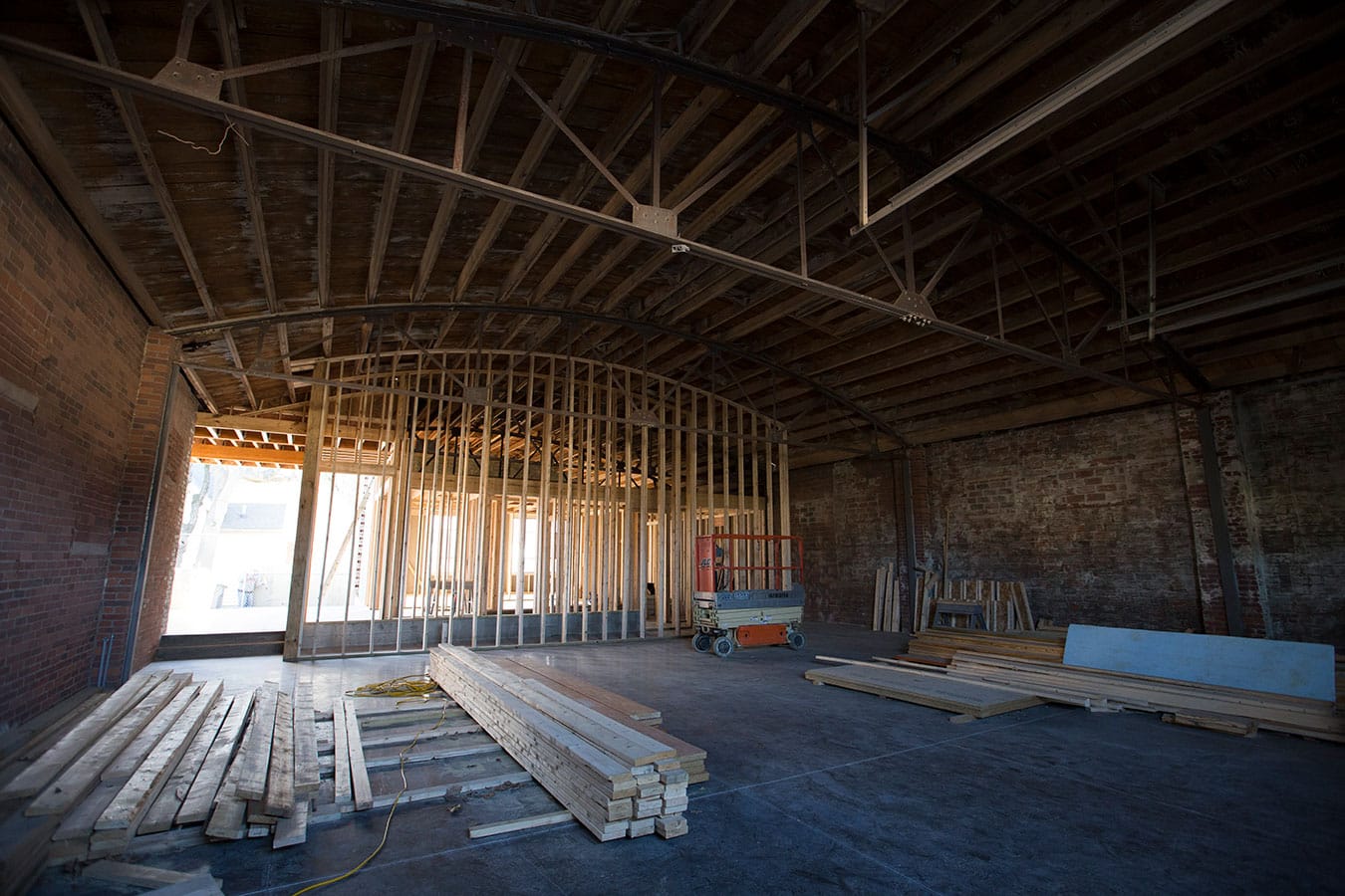 Architectural designer Lauren Bordes is using the original brick, tresses, steel, and wood of the garage in her design for the FAR theater. | Photo by Chaz Mottinger, courtesy of Pictura Gallery