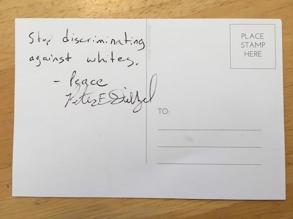 This fall, the Purple Shirt Brigade handed out postcards at the Farmers’ Market for people to write about how white supremacy in the market makes them feel. The cards would be sent to Mayor John Hamilton. This card was signed by ‘Peter E Diezel.’ In April, the <a href="https://chicago.suntimes.com/2019/4/27/18623600/how-groups-tied-to-white-nationalists-are-targeting-chicago-and-kim-foxx" target="“_blank"">Chicago Sun-Times website</a> reported an Indiana man identified as Peter Diezel was associated with Identity Evropa and posted tweets defending Adolf Hitler. | Courtesy photo