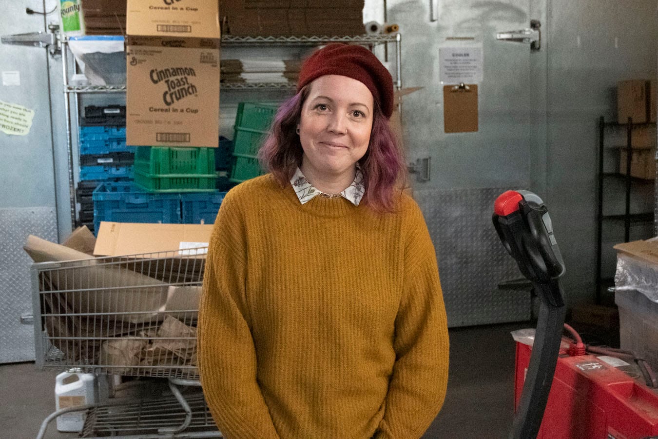 Megan Betz inside the warehouse of Mother Hubbard’s Cupboard. Betz is the CEO and president of the food pantry and community center based in Bloomington. | Photo by Olivia Bianco