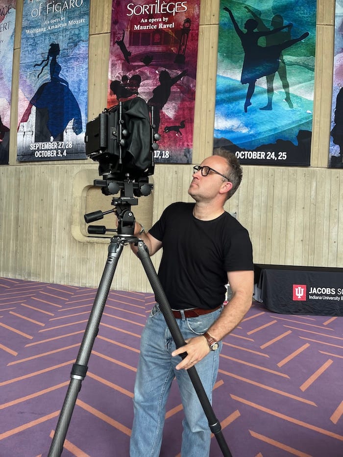 Roman Franc sets up his camera in the lobby of the IU Musical Arts Center. | Limestone Post