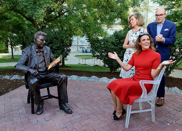 Cooper Pennington’s life-size statue of Alfred C. Kinsey was unveiled in 2022 on the IU–Bloomington campus to celebrate the 75th year of the Kinsey Institute. (l-r) IU President Pamela Whitten and Justin R. Garcia, executive director of the Kinsey Institute, stand behind Cooper Pennington. | Photo by Claude Cookman
