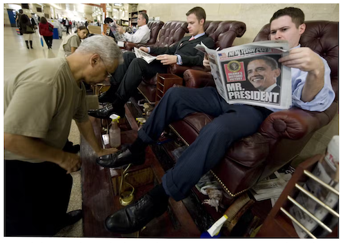 A man reads the New York Post, a local New York City paper, on Nov. 5, 2008, in Grand Central Station. | Photo by <a href="https://www.gettyimages.com/detail/news-photo/man-reads-a-local-newspaper-november-5-2008-in-grand-news-photo/1253526687?adppopup=true" target="_blank">Don Emmert/AFP via Getty Images</a>