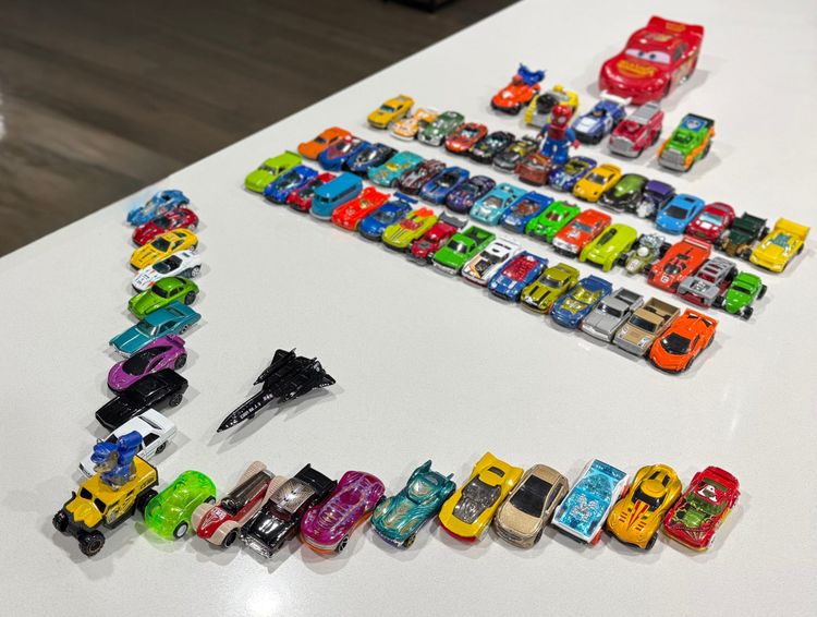 My daughter's subset of toy cars. Picture credit - me! A set of toy cars arranged like an aircraft. Also shown is Blackbird toy model - fastest aircraft I know of!