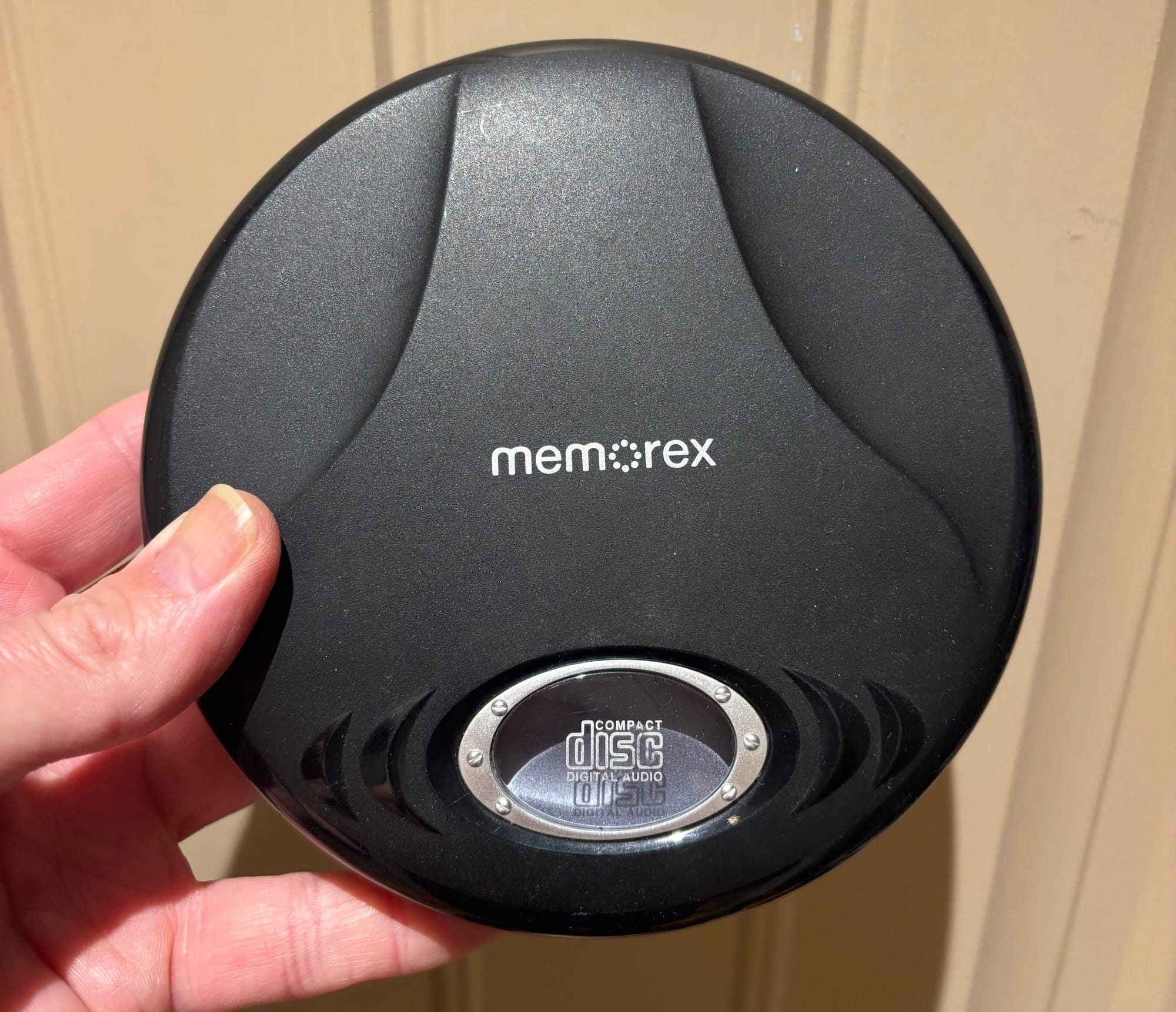 Photo of a black Memorex personal CD player from the late 2000s or early 2010s