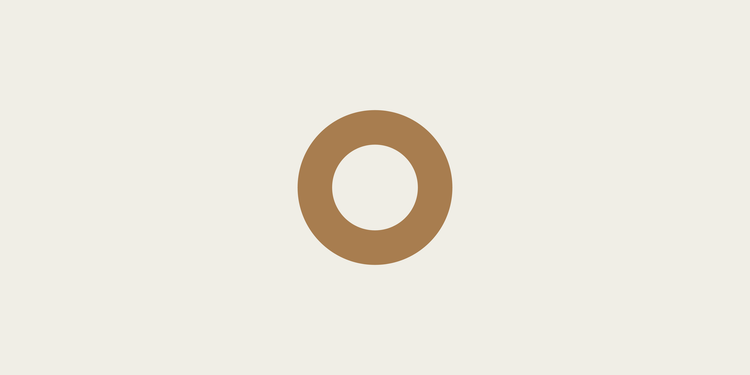 Thick outlined circle shape Contexia logomark in a warm color on a light background.