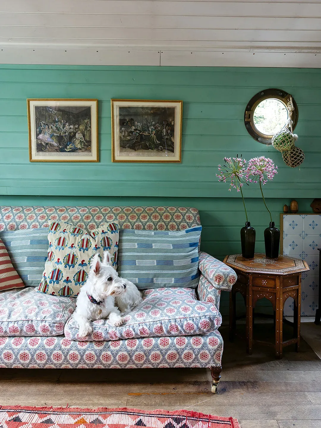 Okay, this turquoise wall pops. Upholstered seat looks comfy — maybe too much color?