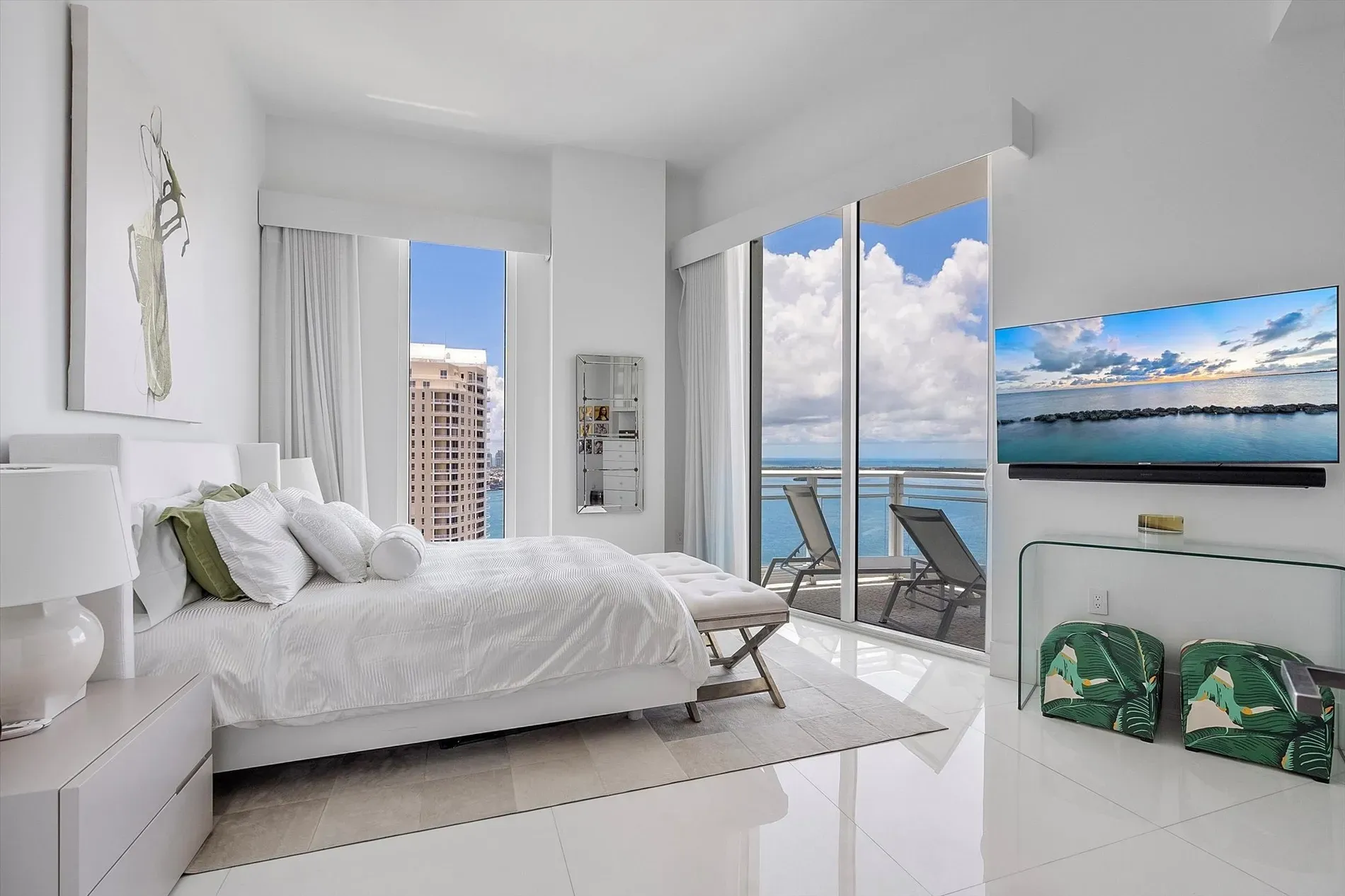 Bedroom’s calm, all whites and that view. Anyone else craving a color?