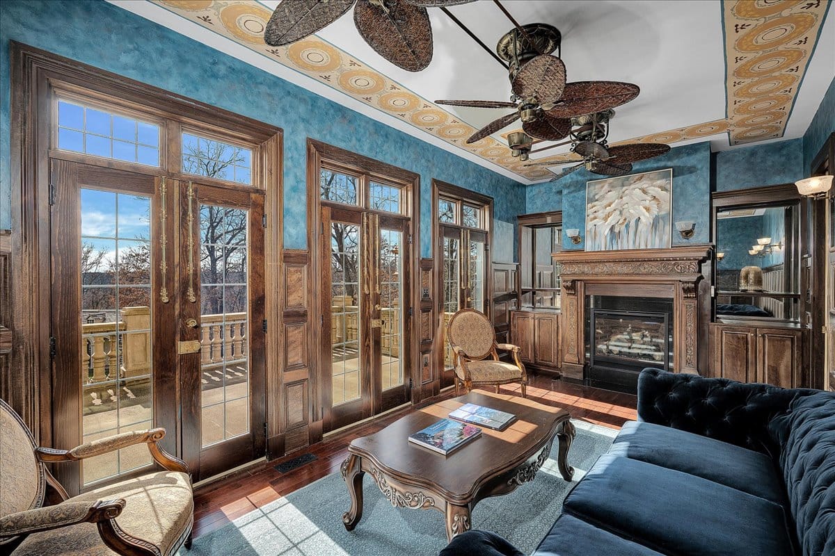 Here’s the sunroom — turquoise walls against dark trim. Ceiling detailing goes hard.