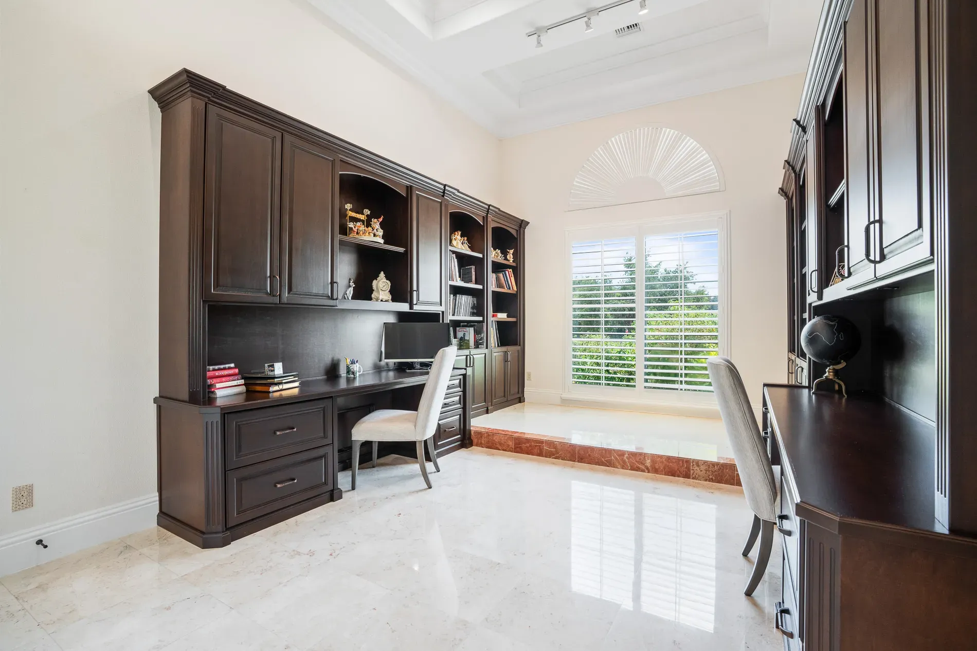 Here's the office—dark built-ins, marble floors. Kinda hotel-lobby fancy.