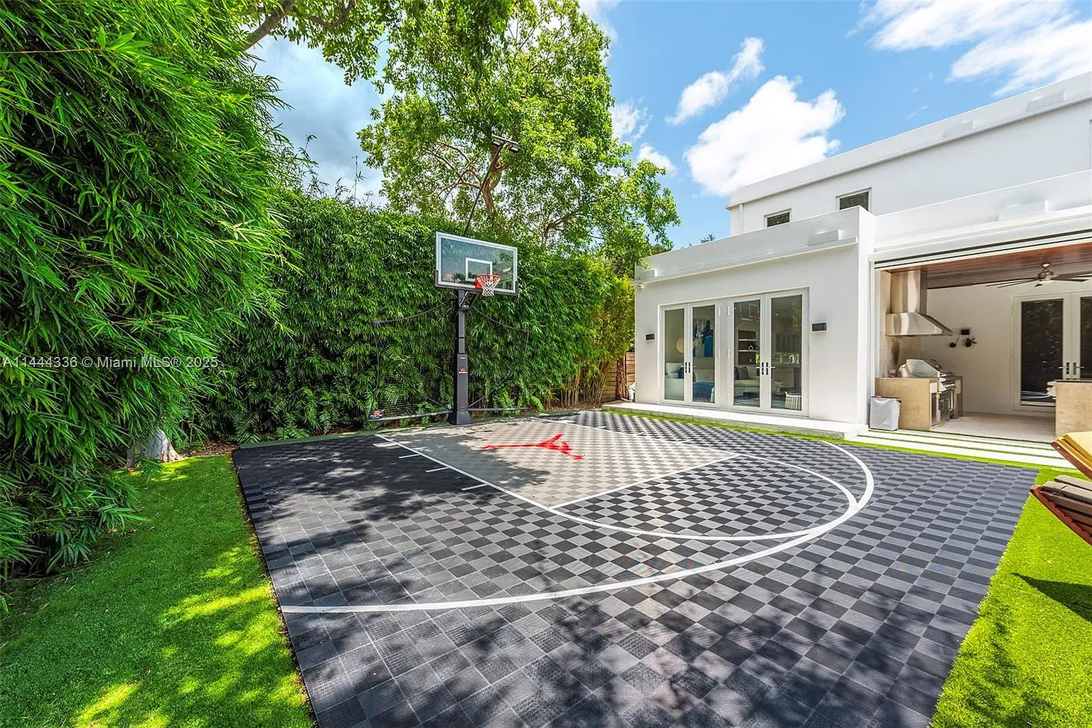 Then a backyard court with checkerboard tiles. Looks slick. Night games?