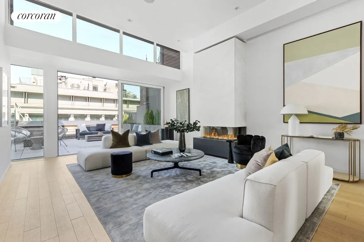 In this shot, super minimal living room—white, beige, massive windows. Peaceful.