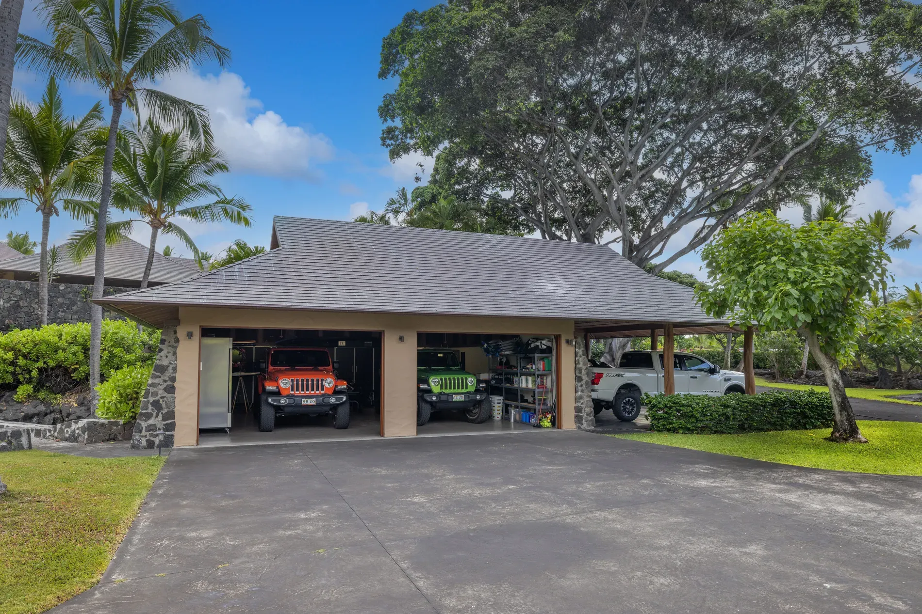 Open carport with a hipped roof. anyone know why no walls?