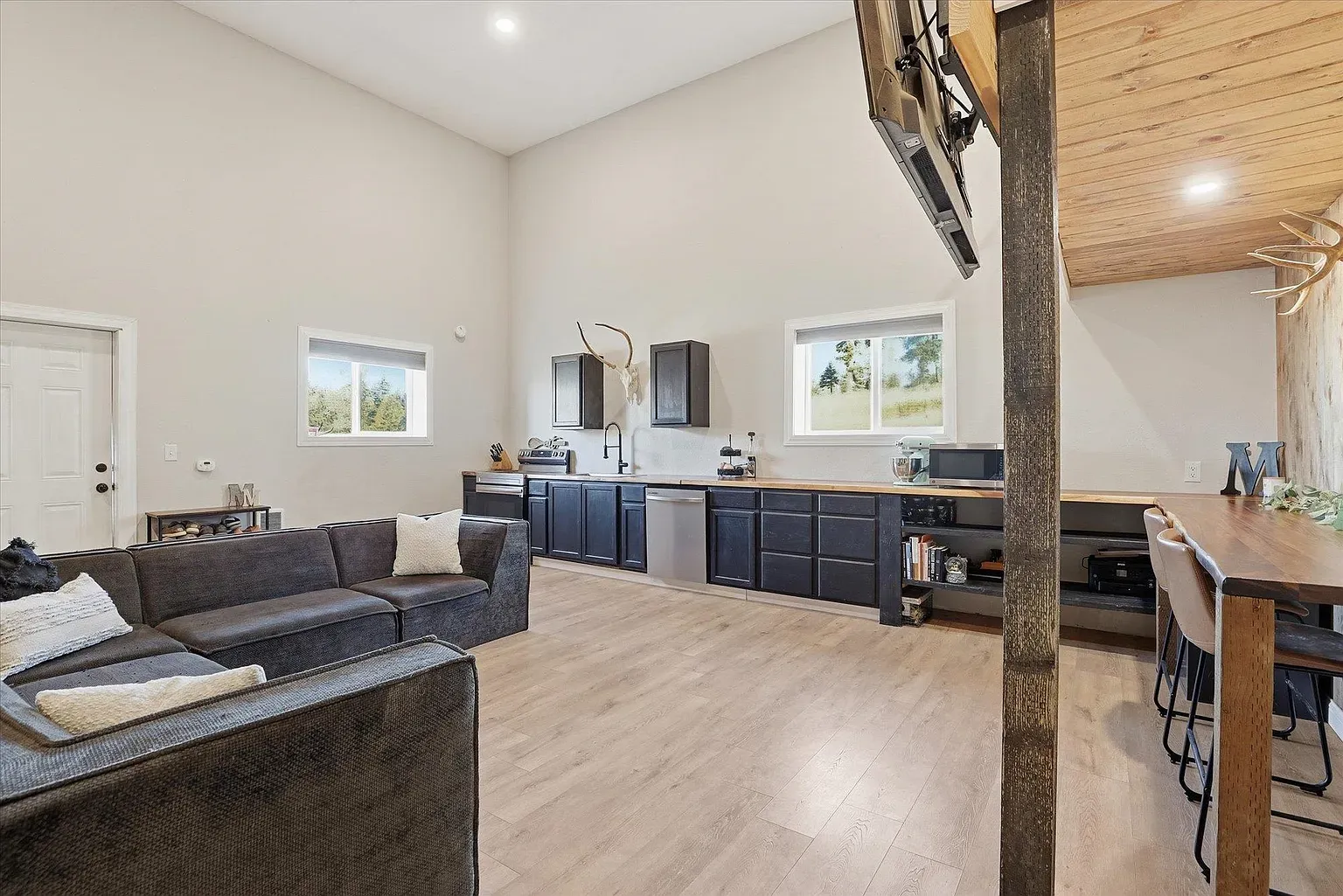 Soaring ceilings do the heavy lifting. This is where the $950k whispers hey.