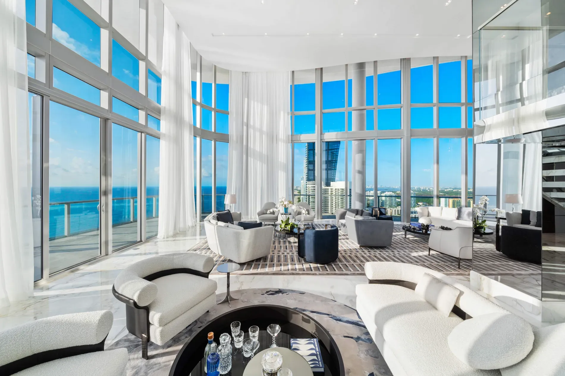 Big living room, grayscale palette. From this angle, the view steals everything.